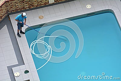 Pool Cleaner Cleaning a Pool Stock Photo