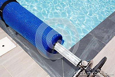 Pool cover blue bubble solar equipment to hot water Stock Photo