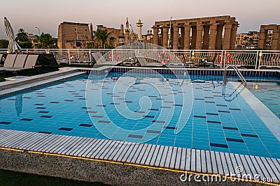 Pool deck and parasols of luxury boat cruise ship in egypt luxor during dawn sunset Stock Photo