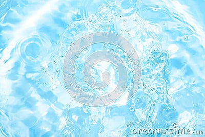 Pool, hot tub or jacuzzi water background. Ripples on bright blue transparent water in swimming pool with light reflection. Top Stock Photo