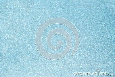 Clear water with shining caustics. Water reflection background in swimming pool. Stock Photo