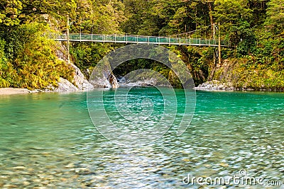 Pools of deep, clear water flowing into the Makarora River offer a moment of Stock Photo