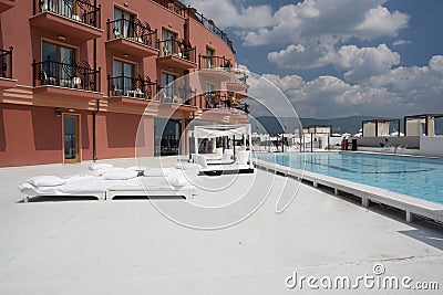 Poolside cabanas and lounges Stock Photo