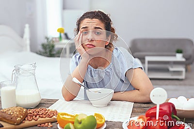 Adolescent lady suffering from low appetite Stock Photo