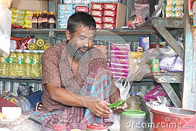 Poor Asian vendor selling betel leaf to the customer. Editorial Stock Photo