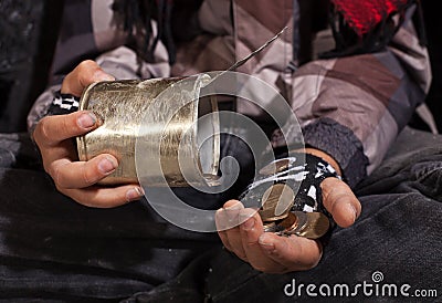 Poor beggar child counting coins - closeup on hands Stock Photo