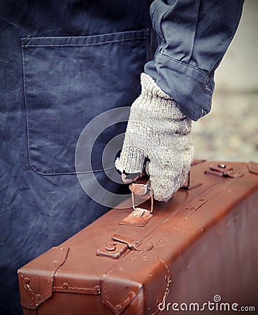 poor emigrated with old leather suitcase Stock Photo