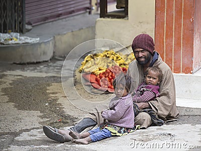 Poor family of beggars on the streets in India Editorial Stock Photo