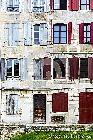 Poor house in a rich city Stock Photo