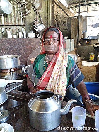 Indian poor Hindu woman working in a hotel for her daily earning Editorial Stock Photo