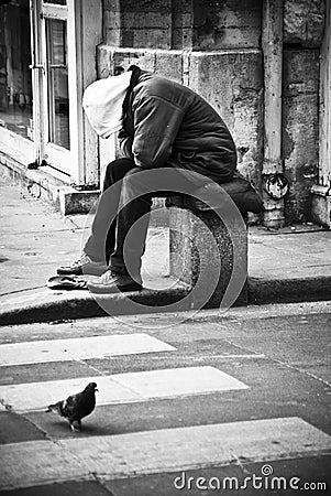 poor man in Paris Editorial Stock Photo