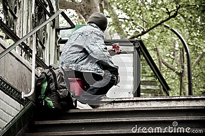 Poor man in Paris Editorial Stock Photo