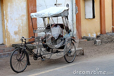 Poor man sleeping in his cycle rickshaw Editorial Stock Photo