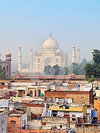 Poor neighborhoods and luxurious Taj Mahal. Agra, India Stock Photo