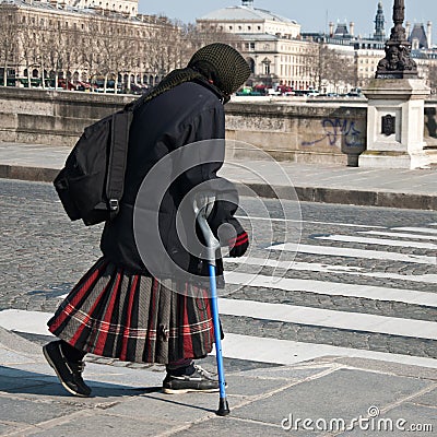 poor old gipsy woman with crutch Editorial Stock Photo