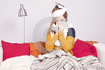 Poor sick woman, blowing her nose. Stock Photo