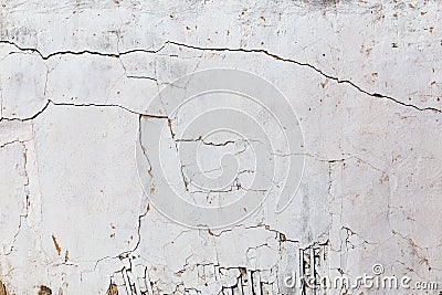 Poor wattle and daub cracked stucco wall with white plaster Stock Photo