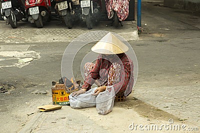 Poor woman in Ho Chi Minh, Vietnam Editorial Stock Photo