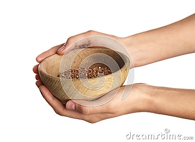 Poor woman holding bowl with grains Stock Photo