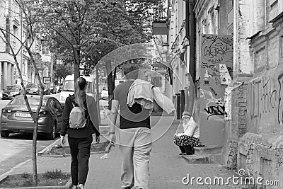 The poor woman who was kicked out of the apartment by her relatives. Editorial Stock Photo