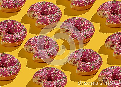 Pop art collage of bitten glazed donuts on a yellow background. Food background Stock Photo