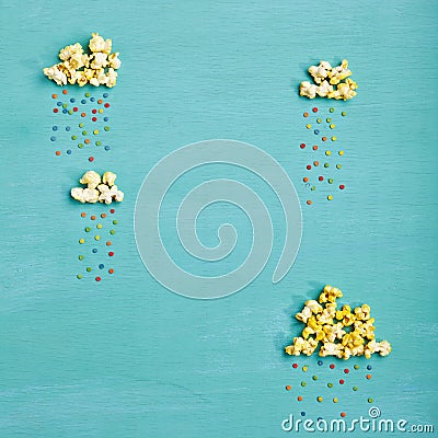 Popcorn Clouds with Colorful Rain Stock Photo