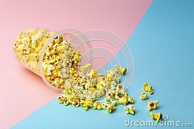 Popcorn on a colored background. Minimal food concept. Entertainment, film and video content. Aesthetics 80s and 90s concept Stock Photo
