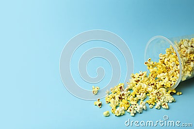 Popcorn on a colored background. Minimal food concept. Entertainment, film and video content. Aesthetics 80s and 90s concept Stock Photo