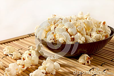 Popcorn over filled in bowl Stock Photo