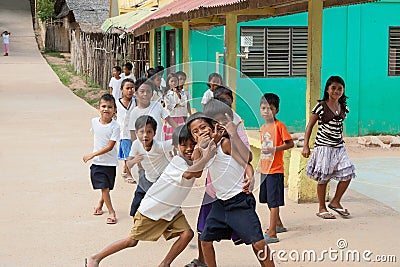 POPOTOTAN ISLAND, BUSUANGA, PHILIPPINES - JANUARY 20,2012 - Children playing on a school break in the Philippine village Editorial Stock Photo