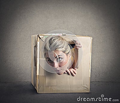 Popping out from a small box Stock Photo