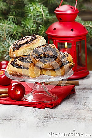 Poppy seed buns on cake stand. Christmas eve setting Stock Photo