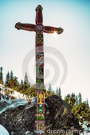 Decorated wooden cross in monument Symbolic cemetery in High Tatras mountains in Slovakia Editorial Stock Photo