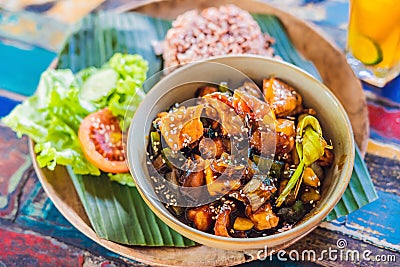 Popular Balinese meal of rice with variety of side dishes which are served together with the rice and more as optional extras Stock Photo