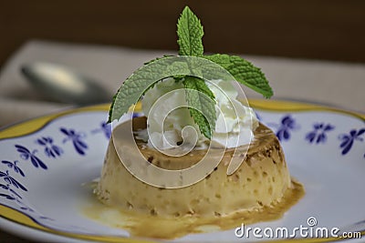 Popular cheese custard, Spanish dessert with caramel sauce layer and whipped cream Stock Photo
