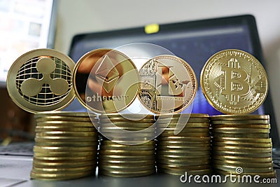 Cryptocurrency litecoin, bitcoin, ripple and ethereum with computer laptop on background Editorial Stock Photo