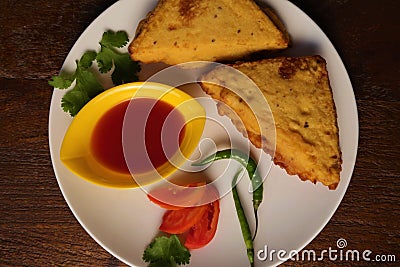popular Indian snacks BREAD PAKORA with tomato sauce and green chilli, Stock Photo