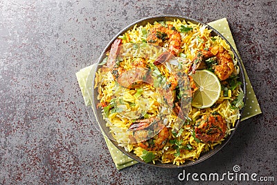 Popular Iranian seafood pilaf Meygoo Polo with herbs and prawns closeup on the plate. Horizontal top view Stock Photo