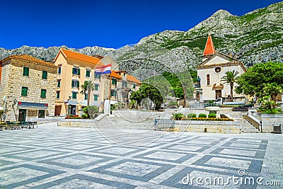 Mediterranean old city center with church and street cafees, Makarska Editorial Stock Photo
