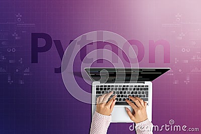 The popular Python programming language with a person behind a laptop Stock Photo