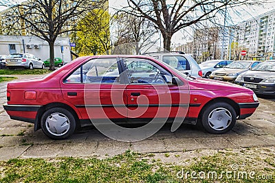 Classic red French Peugeot 405 GL sedan private car parked Editorial Stock Photo