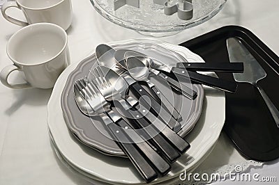 Porcelain Dishes, Plates, Coffee Cup and Silverware Stock Photo