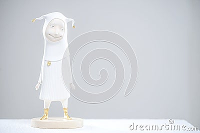 Porcelain paper mache clay statuette jester Stock Photo