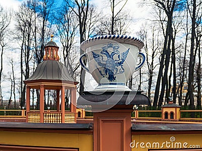 Porcelain vase with the royal coat of arms in a bosquet in the S Stock Photo