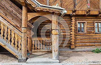 Porch at the entrance to the log house. Russian architecture Stock Photo