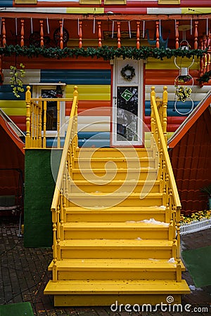 The porch of the house, parts of which are turned upside down - doors, balcony, roof Editorial Stock Photo