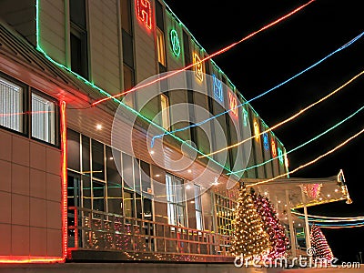 Porch office building close-up. New Year. Decorated Christmas tree with garlands. Editorial Stock Photo