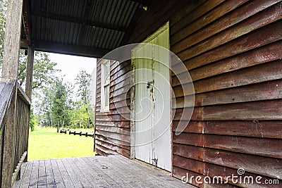 Porch of an old wooden weatherboard building. Stock Photo