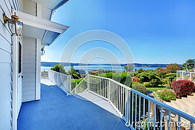 Porch with water view and grey house. Stock Photo