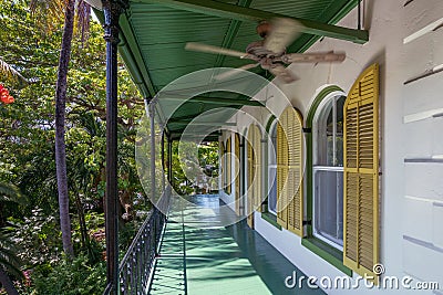 Porch of wooden house in spanish colonial style with a porch. Wooden district of Key West, Florida. Editorial Stock Photo